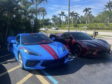 Two C8 Corvettes parked side-by-side outside in the parking lot after service at Walter's Auto Service Center in Fort Myers, Florida